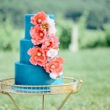 blue cake with orange flowers