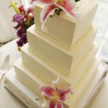 square wedding cake with hibiscus